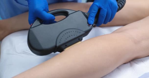 Master Making Laser Epilation Skin Legs Woman Client Beauty Salon — Stockvideo