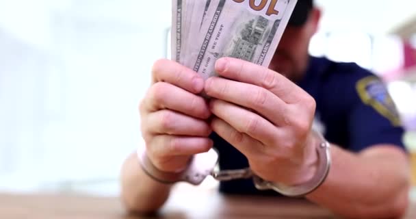 Policeman Handcuffs Holding Bunch Dollars Hand Closeup Movie Slow Motion — Stock Video