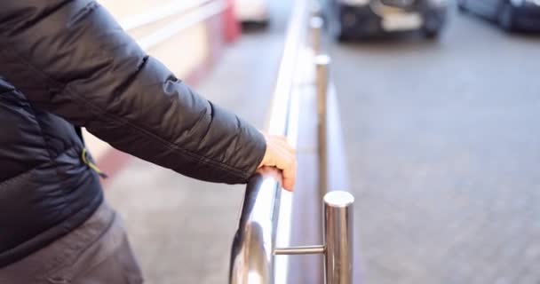 Man Comes Holding Metal Railing Stairs Safety Concept — Stock Video