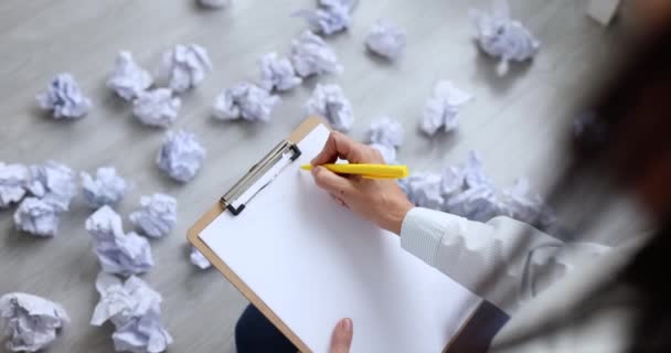 Woman Writing Business Plan Documents Crumpled Scattered Floor Movie Slow — Stock Video