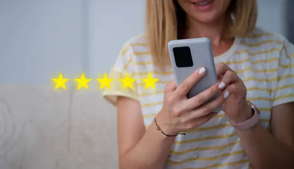Woman Holding Mobile Phone Her Hands Giving Five Star Rating Stock Photo
