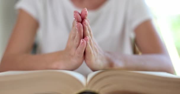 Woman Prays Hands Clasped Bible Faith God Prayer Concept — Stock Video