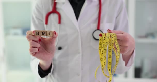 Doctor Nutritionist Holds Word Bmi Measuring Tape Body Mass Index — Stock Video