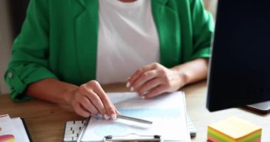 Businesswoman showing ok approved gesture at workplace. Online communication consultant service recommendation