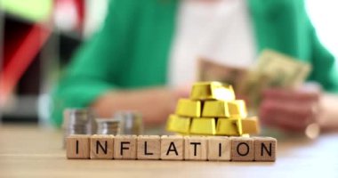 Inflation stacks of gold bars businesswoman considers declining income dollars. Reducing price of gold in trading commodities in investment market