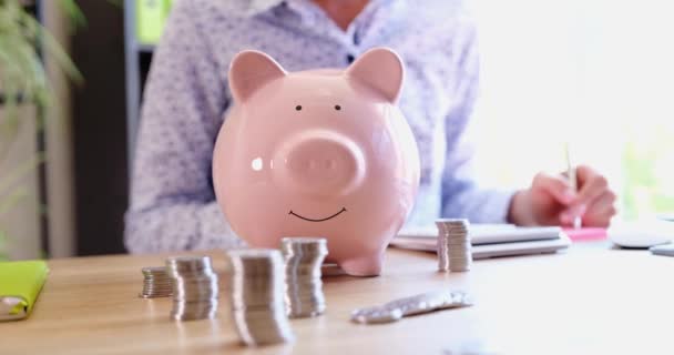 Woman Counts Financial Savings Calculator Piggy Bank Control Expenses Cash — Vídeo de stock