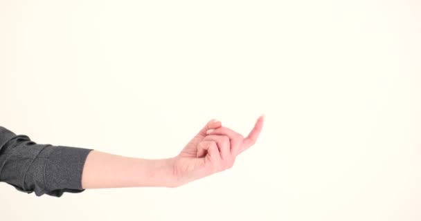 Vrouwelijke Wijsvinger Een Beroep Witte Achtergrond Closeup Film Slow Motion — Stockvideo