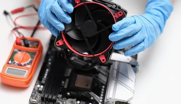 Cleaning and repairing personal computer and replacing or installing fan. Computer service and maintenance.
