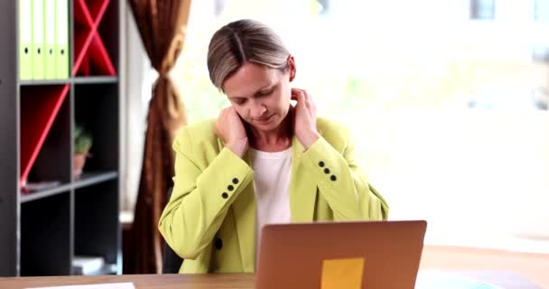 Woman Touching Sore Neck Pained Expression Businesswoman Suffering Neck Pain — Stock Video