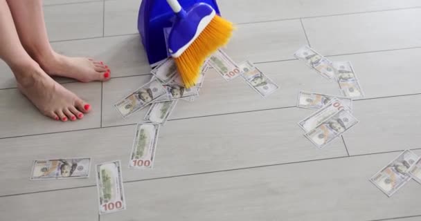 Housewife Broom Sweeps Paper Dollar Bills Blue Dustpan Closeup Concept — Stock Video