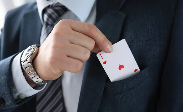Man suit takes an ace card from his jacket pocket. One-sided advantage and benefit. Technique or manipulation trick. Demonstration bait. Manual control with levers, manipulator mechanisms