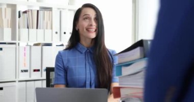 Businesswoman hands over large amount of documents to manager. Delegation of authority to employees concept