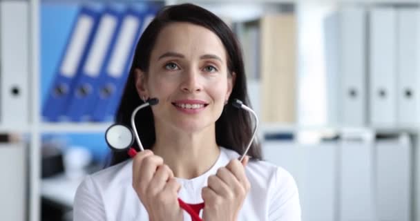 Smiling Female Doctor Putting Stethoscope Quality Medical Services Concept — Wideo stockowe