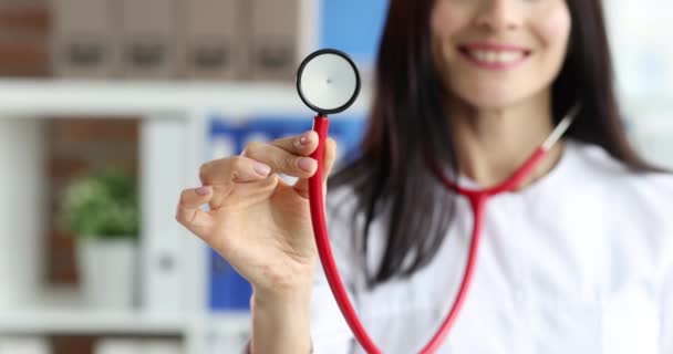 Smiling Female Doctor White Coat Holding Stethoscope Medical Services Concept — Stockvideo