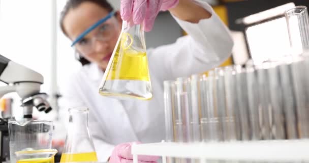 Scientist Hands Gloves Hold Sterile Flask Yellow Liquid Oil Research — Stok video