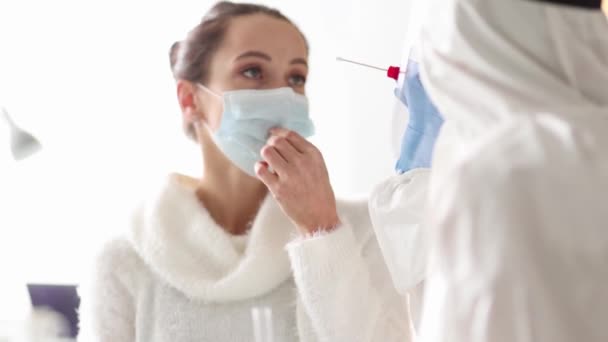 Doctor Protective Suit Takes Swab Woman Nose Laboratory Tests Coronavirus — стокове відео