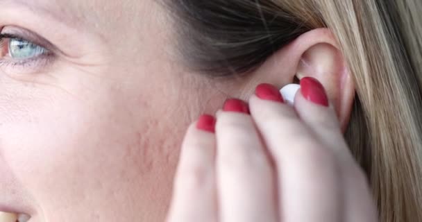 Woman Inserts Wireless Headphones Ear Listening Music Headphones — Stock Video