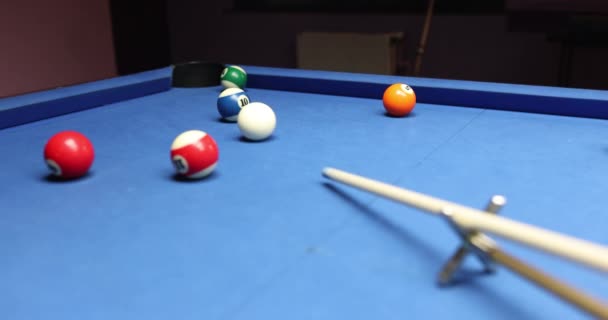 Person Hits White Ball Leaning Blue Pool Table Player Using — Stock Video