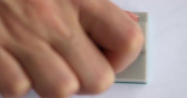 Hand putting green stamp approved on important document closeup 4k movie slow motion. Permission and approvals concept