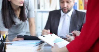 Business partners studying graphs on documents closeup 4k movie slow motion. Business development strategy concept