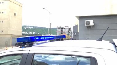 Blue flasher on police car closeup 4k movie. Emergency 911 rescue services concept