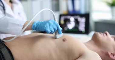 Ultrasound for man chest scan and heart diagnosis. Heart pain causes and treatment concept