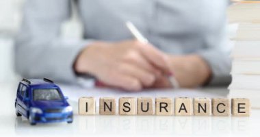 Insurance agent fills out car insurance contract. Transport insurance and cash payments concept