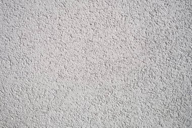 Açık gri desenli duvar yüzeyinin detaylı bir yakın çekimi güzel desenler ve tasarımlar sergiliyor.