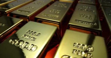 Özel işaretli altın külçeler bankada sıra sıra dizilmiş ışığı yansıtır. Zenginliği ve finansal güvenliği sembolize eden değerli değerli bir metal.