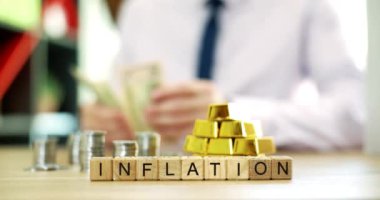 Enflasyonun, altın ve para birimlerinin temel sembolleri olarak kullanılması yoluyla finans üzerindeki önemli etkisini araştırıyoruz.