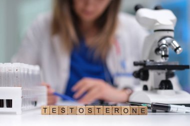 In a laboratory environment, a scientist meticulously analyzes testosterone samples using a highpowered microscope clipart