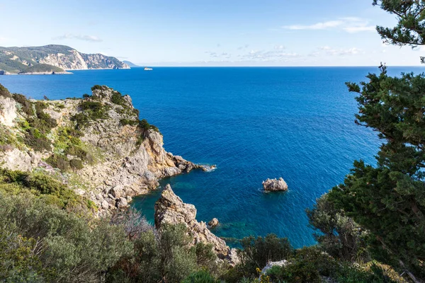 stock image  A beautiful landscape of the coast of the island of Corfu in the Ionian Sea of the Mediterranean in Greece. Pure blue clear water washes over the shores of the Greek island.