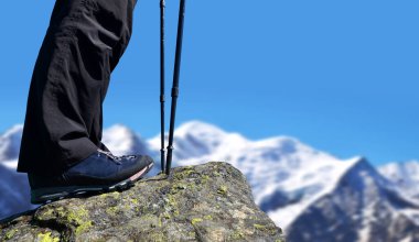 Hiker in the Graian Alps. Mont Blanc mountain range, Nature Reserve Aiguilles Rouges, France.