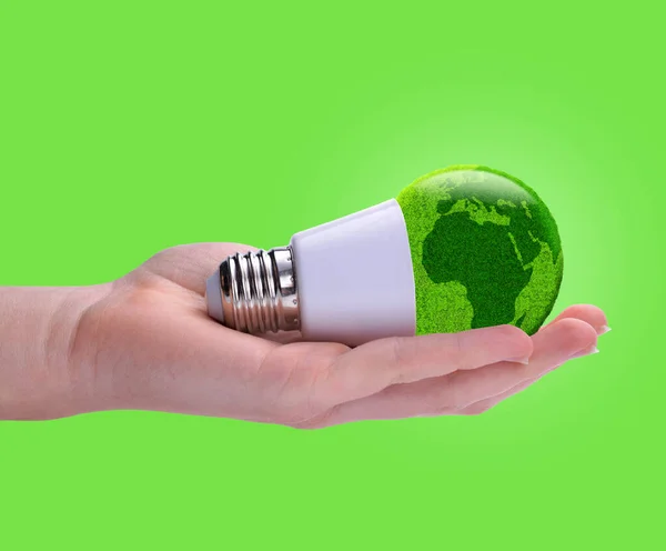 Lâmpada Led Eco Mão Isolado Fundo Verde Conceito Energia Verde — Fotografia de Stock