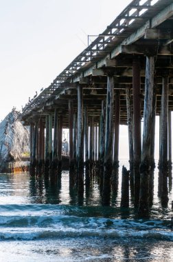 Exterior shot of the wooden support structure that carries the Sea Cliff Pier near Aptos, California.