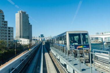 Tokyo, Japan - January 9, 2020. A view from the car of a light rail train in downtown Tokyo.