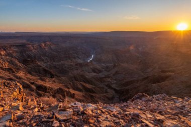 Landscape shot of the sunset over the Fish River Canyon in Southern Namibia. clipart