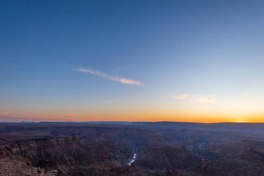 Landscape shot of the sunset over the Fish River Canyon in Southern Namibia. clipart