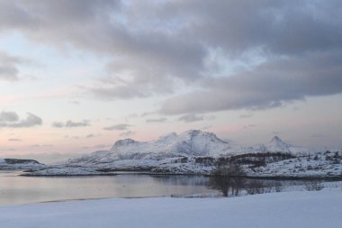 A snow-covered Fjord near the Mjelle community, just north of Bodo, on a wintery day in Arctic Norway.
