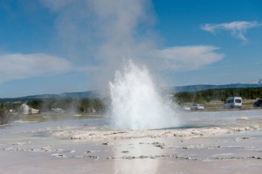 Eruption of the Great Fountain Geyser in Yellowstone National park. clipart