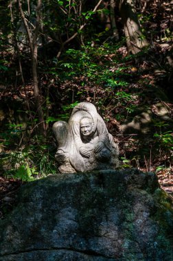 Hiroshima, Japan - January 2, 2020. Close-up of a statue at the famour Mitaki Dera Temple in Hiroshima Japan.