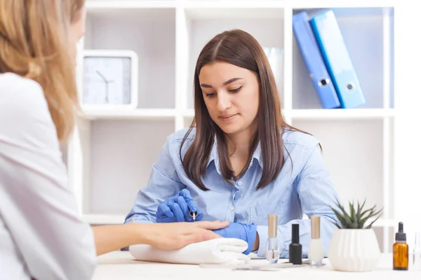 Beautician Puts Nails Client Woman Nail Salon Getting Manicure Cosmetologist — Stock Photo, Image