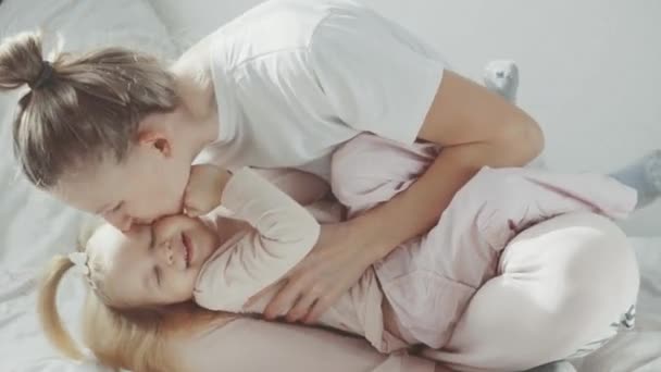 Mom Plays Tickle Her Little Daughter Light Video Stock Footage