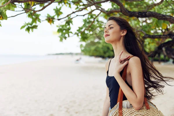 copy woman sky walk summer sunlight travel caucasian beach adult happy nature space young outdoor vacation sand long freedom smile sea ocean hair