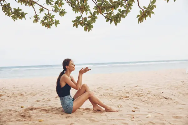 woman hair person alone beautiful beauty nature freedom attractive ocean view fashion smile back sand sea sitting body travel beach relax vacation