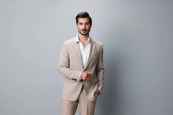 formal man smiling businessman copyspace white happy beige isolated occupation portrait standing handsome executive male attractive person eyeglass business grey suit