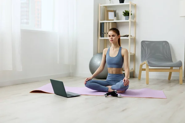 woman lifestyle healthy fit home carpet indoor health care pilates training space laptop violent workout yoga video lotus living copy mat person