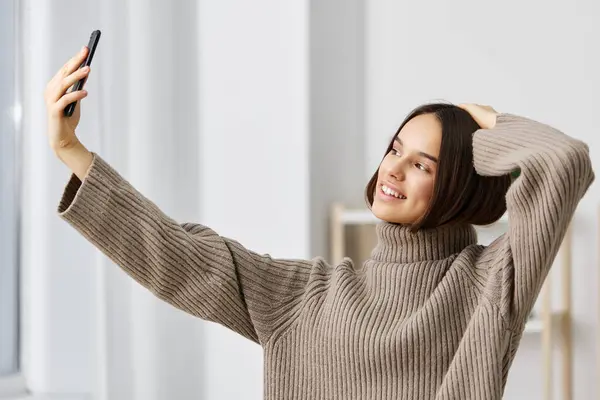woman phone room selfie pretty trendy person video house call smartphone emotion home blogger comfortable cellphone camera blog lifestyle portrait mobile photo