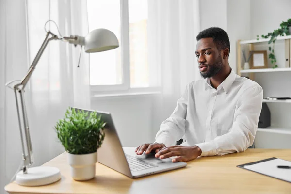 stock image man freelancer american blank african home office education distance online computer space cyberspace laptop student entrepreneur african male smiling indoor using businessman job