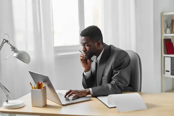sitting man career businessman internet american online copy web computer office student freelance laptop freelancer call male space education african person desk job